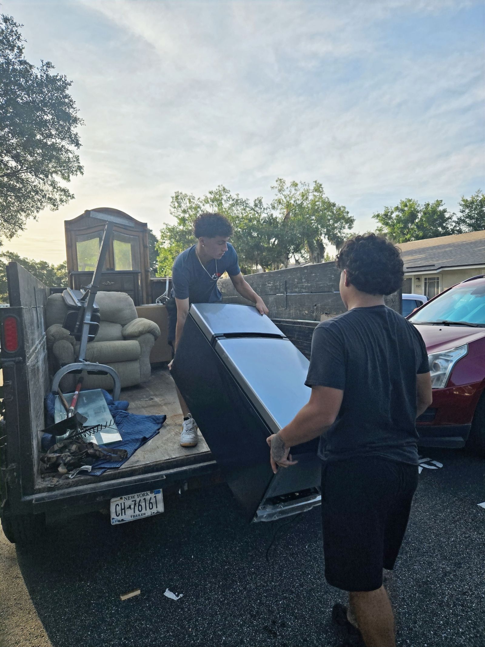 Refrigerator and furniture removal during a junk haul in Eustis, FL