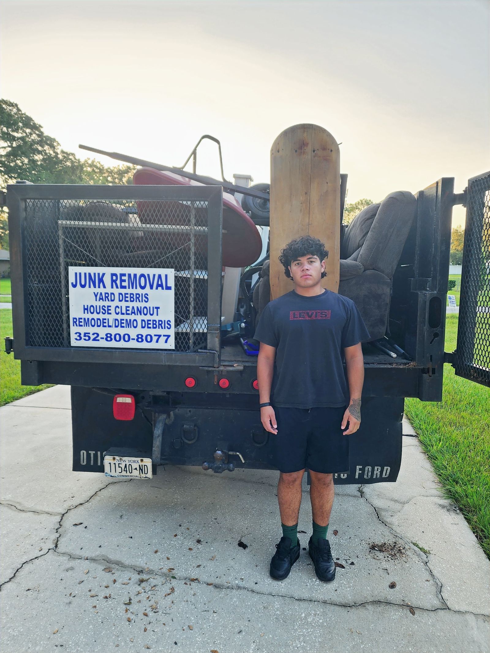 House cleanout junk truck loaded after property cleanup in Eustis, FL