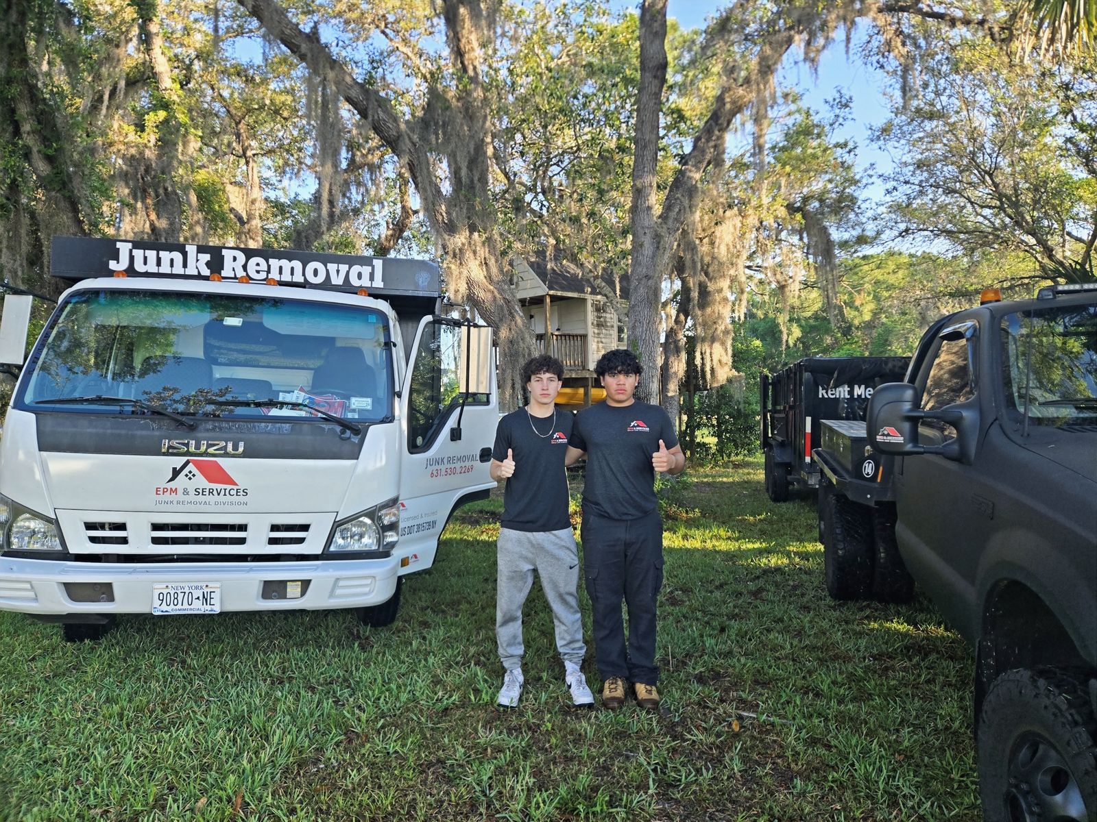 EPM & Services junk removal crew and trucks in Eustis, Florida